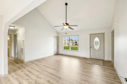 a view of an empty room with a window