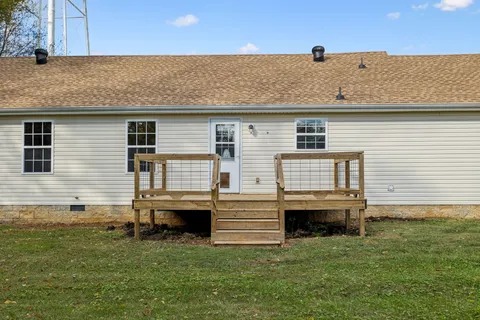 a view of a swimming pool with a yard