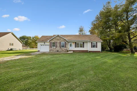 a view of a house with a big yard