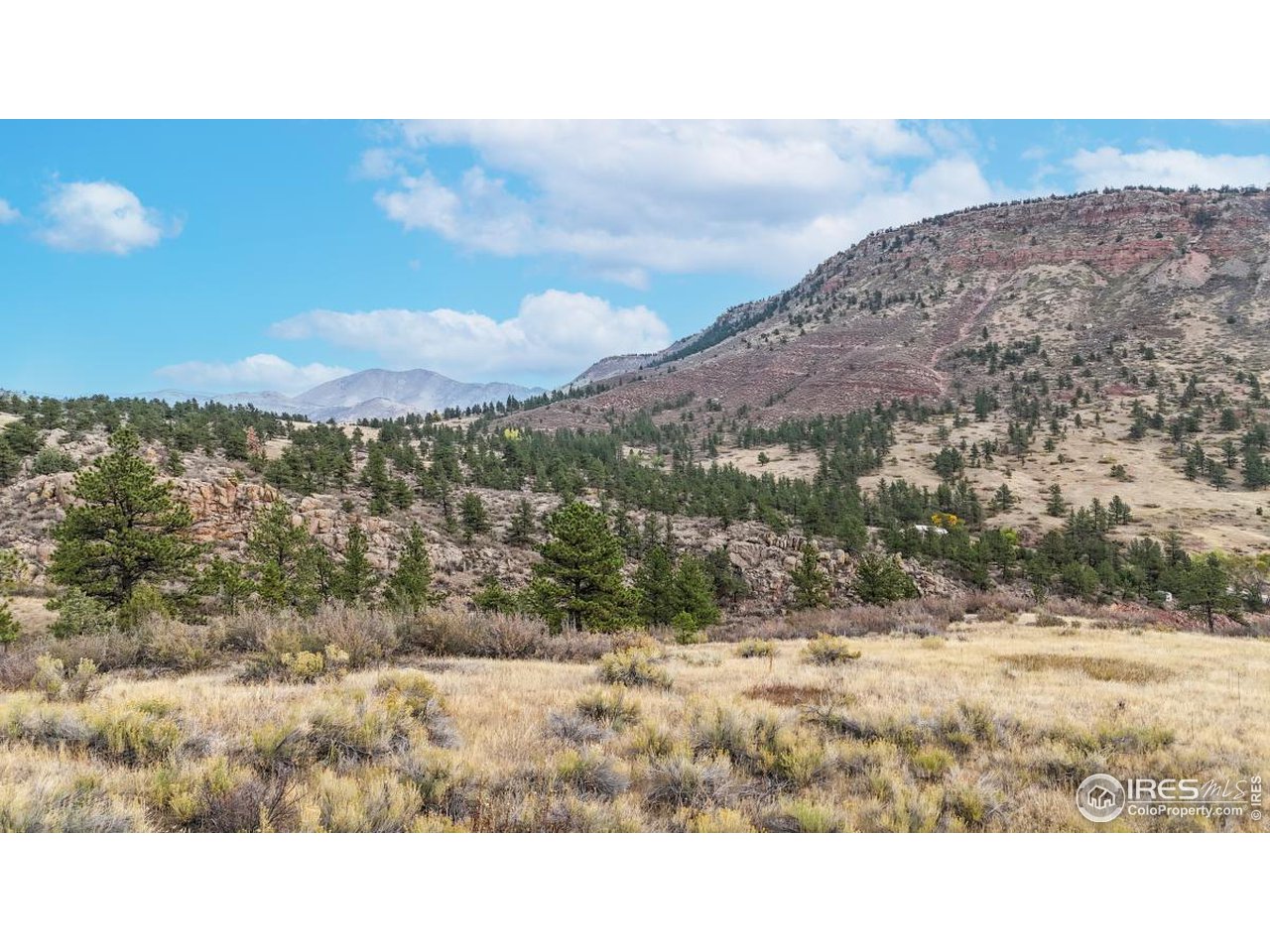 0 Apple Valley Road Lyons, CO 80540 - Photo 7 of 15 a view of a dry yard with mountains in the background