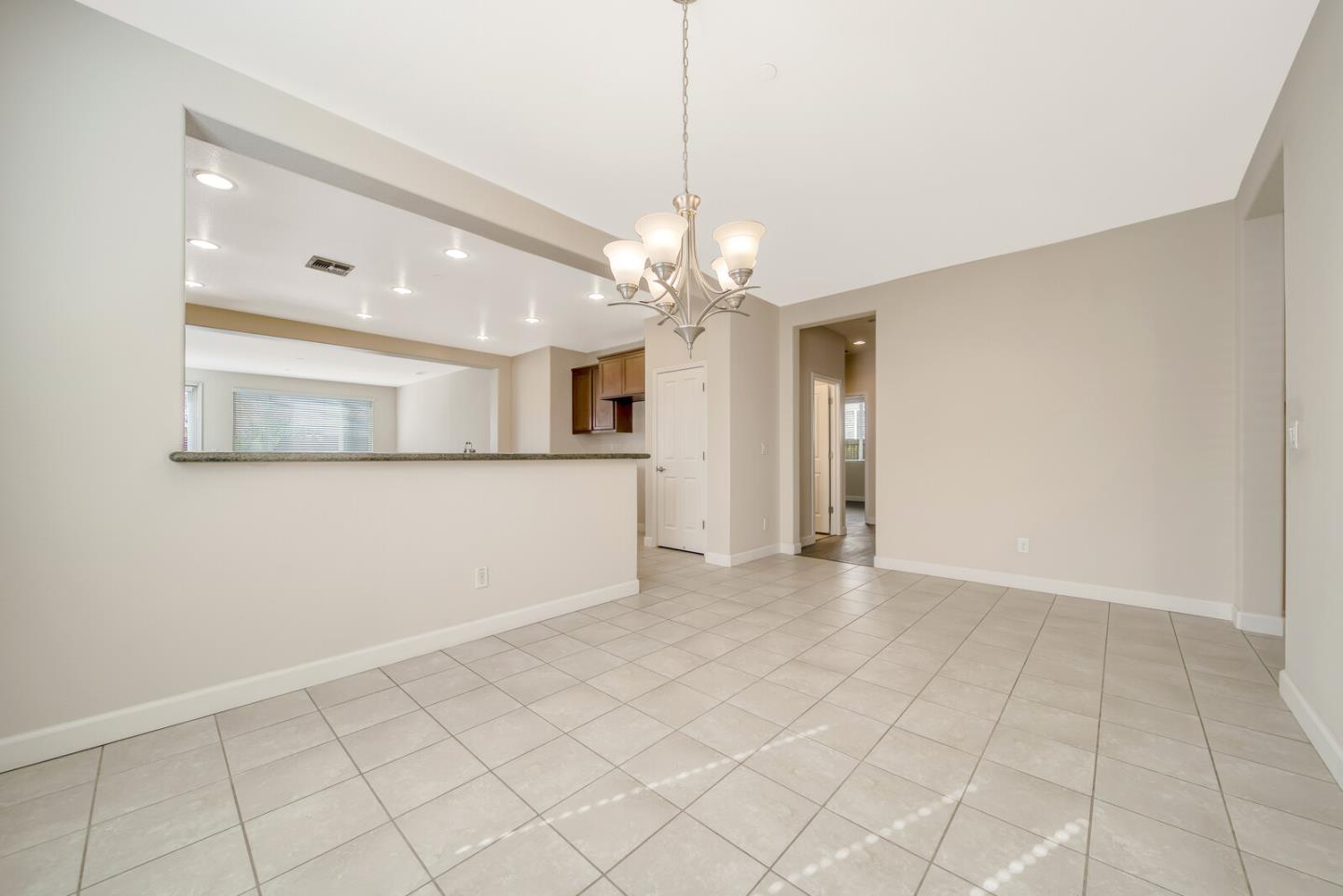 1479 Orgullo Lane Manteca, CA 95337 - Photo 12 of 39 an empty room with kitchen and a window