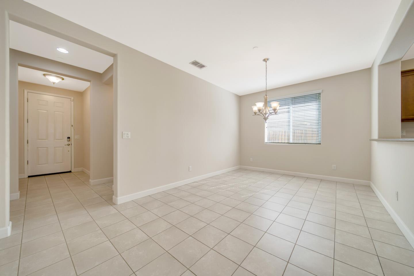 1479 Orgullo Lane Manteca, CA 95337 - Photo 13 of 39 an empty room with windows and ceiling fan