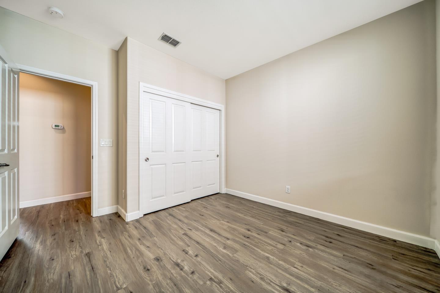 1479 Orgullo Lane Manteca, CA 95337 - Photo 25 of 39 wooden floor in an empty room
