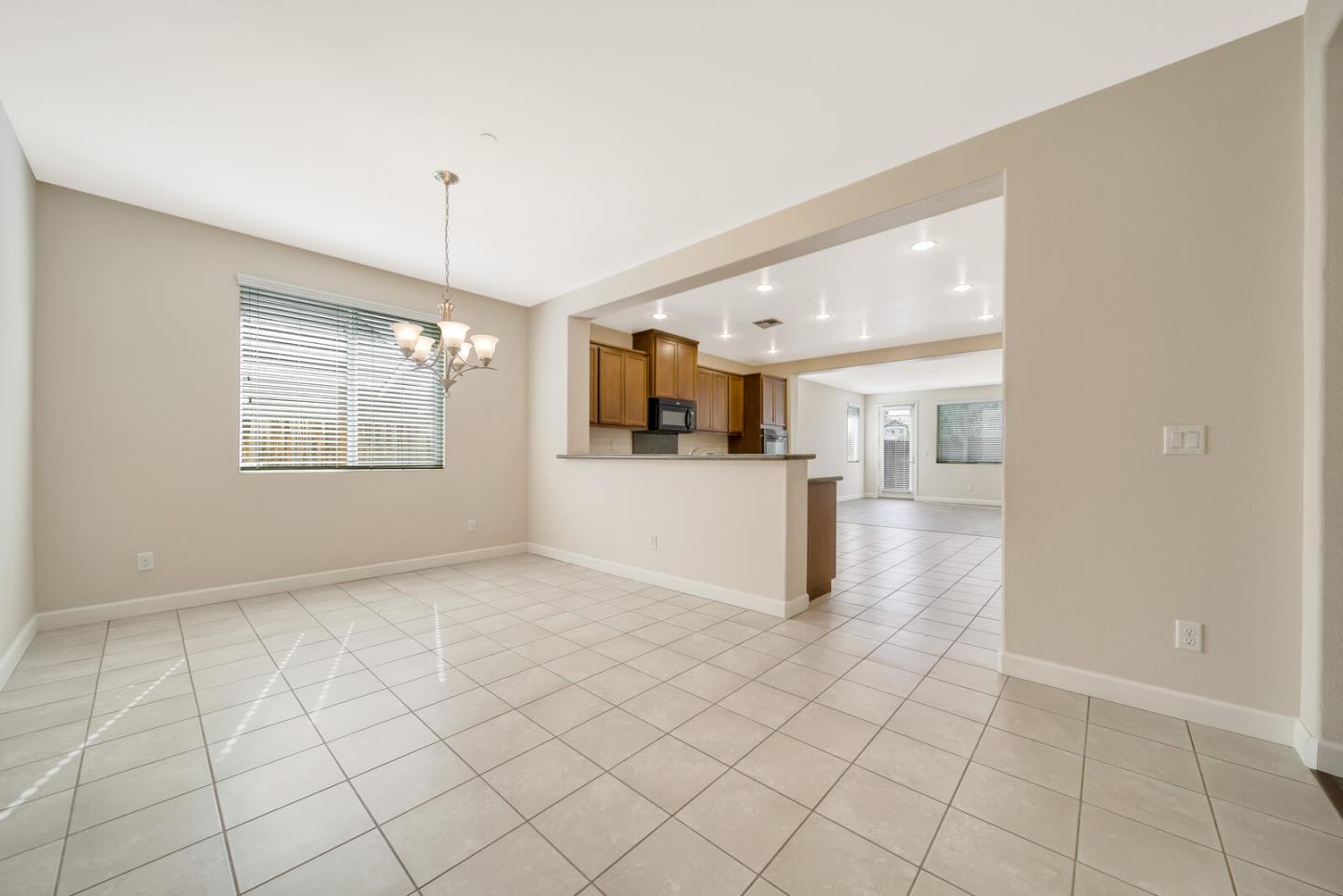 1479 Orgullo Lane Manteca, CA 95337 - Photo 10 of 39 a view of a kitchen with furniture and a kitchen