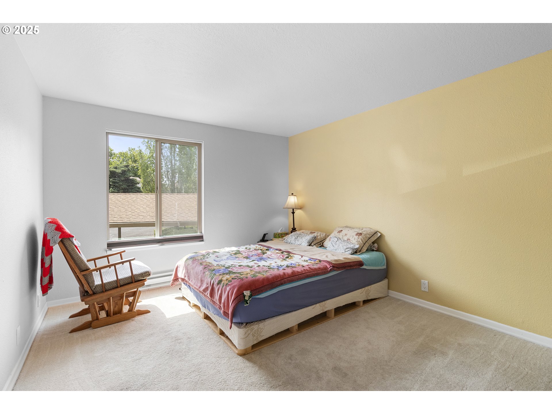 10137 Southwest Trapper Terrace Beaverton, OR 97008 - Photo 15 of 39 a bedroom with a bed chair and a window