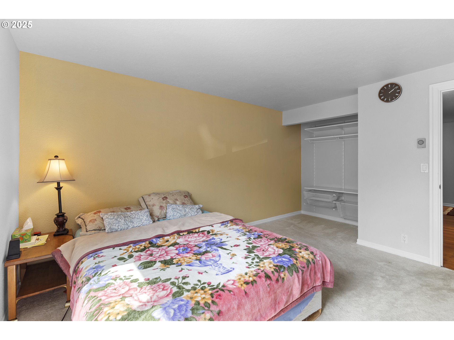 10137 Southwest Trapper Terrace Beaverton, OR 97008 - Photo 17 of 39 a bedroom with a bed and a lamp