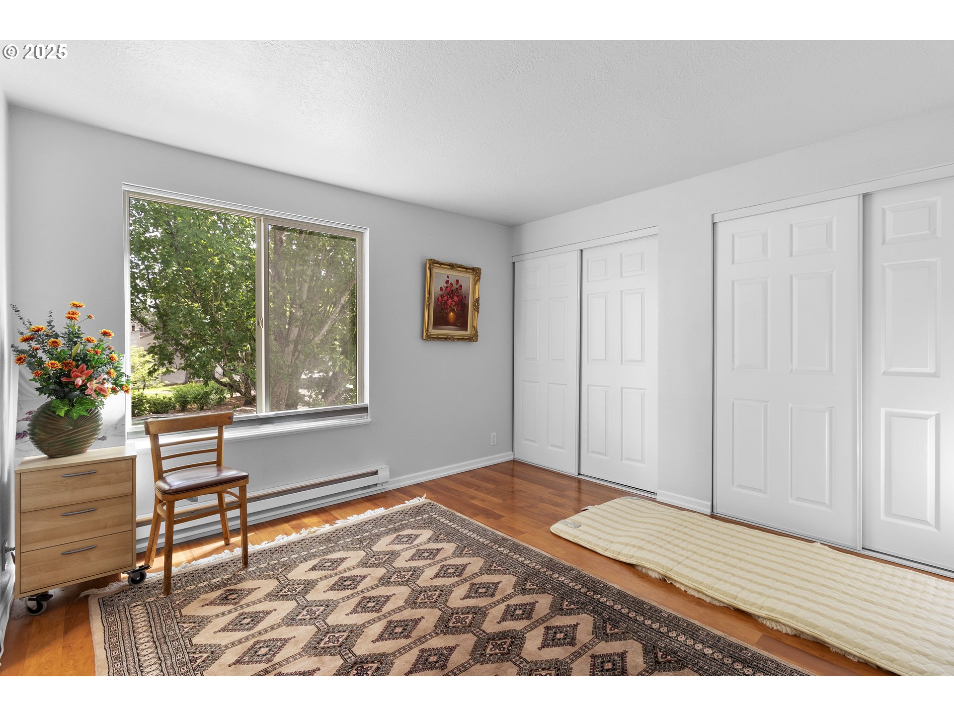 10137 Southwest Trapper Terrace Beaverton, OR 97008 - Photo 19 of 39 a bedroom with a bed and a window