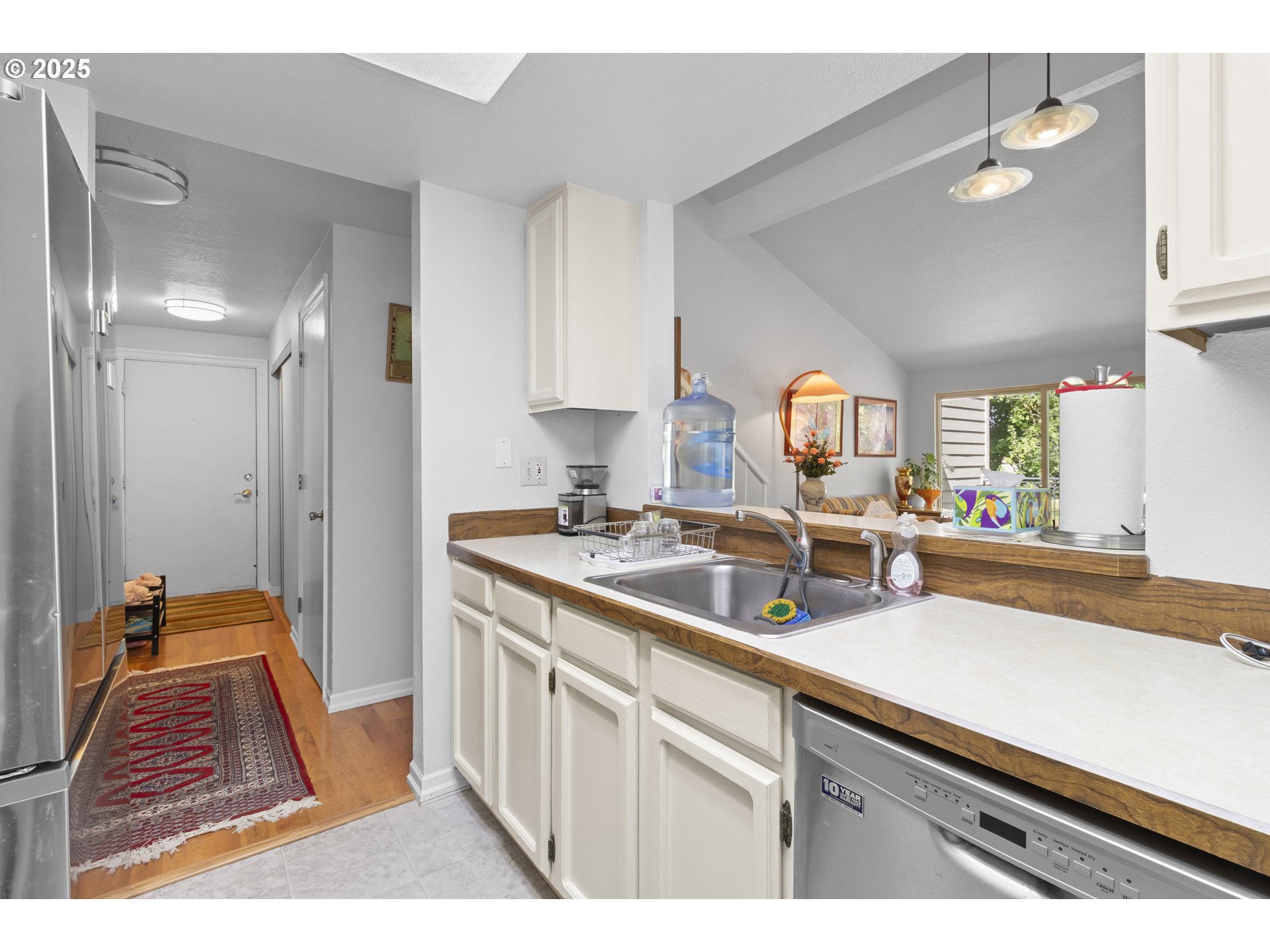 10137 Southwest Trapper Terrace Beaverton, OR 97008 - Photo 25 of 39 a kitchen with white cabinets and sink