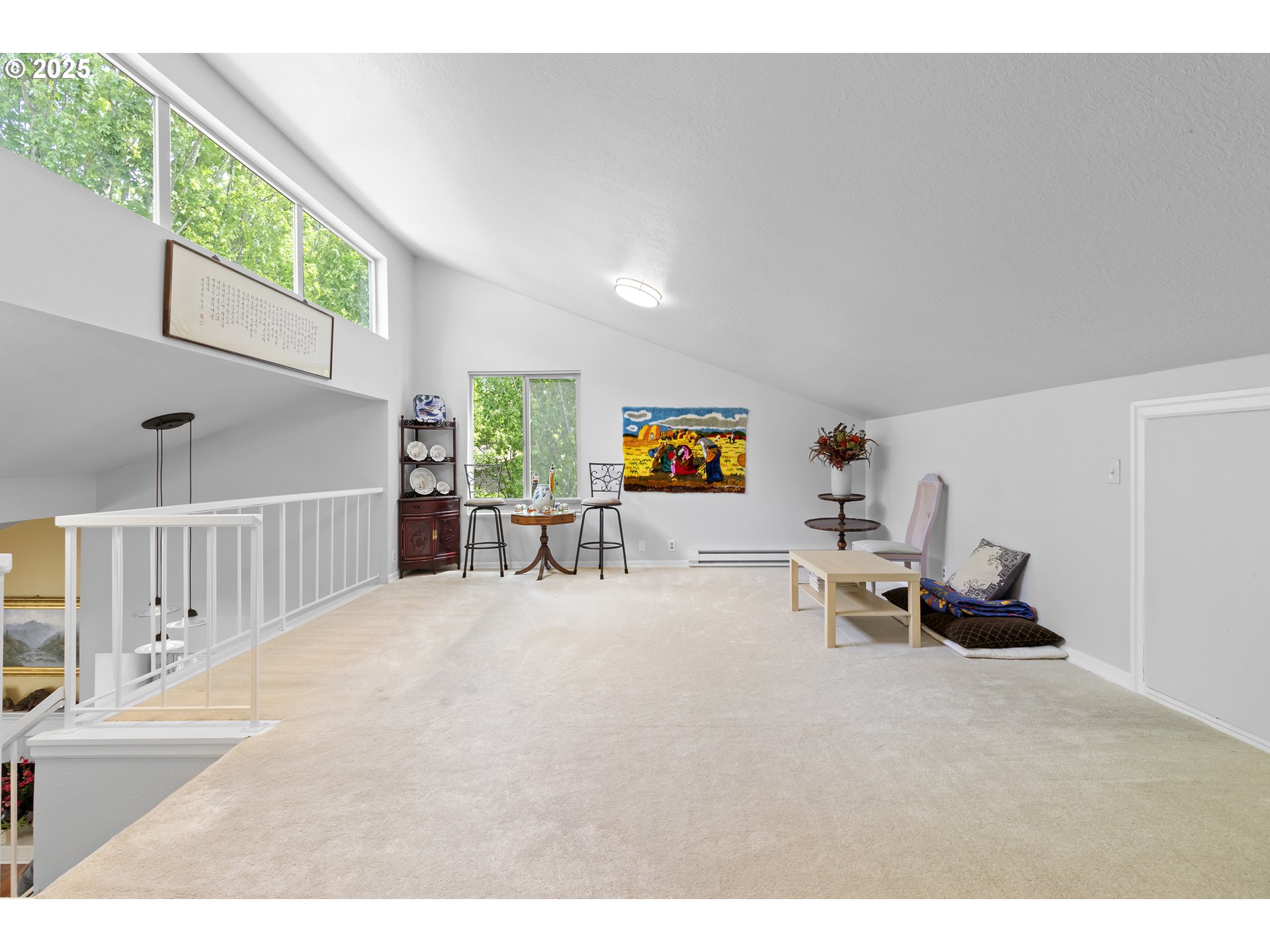 10137 Southwest Trapper Terrace Beaverton, OR 97008 - Photo 27 of 39 a living room with furniture and a large window