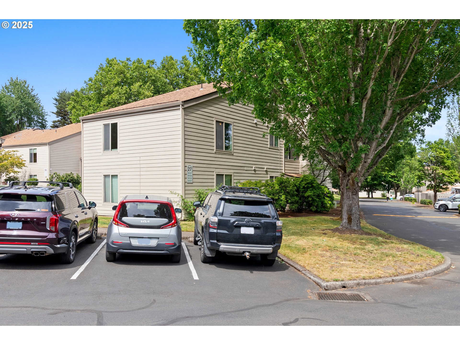 10137 Southwest Trapper Terrace Beaverton, OR 97008 - Photo 35 of 39 a view of a white car parked in front of a house