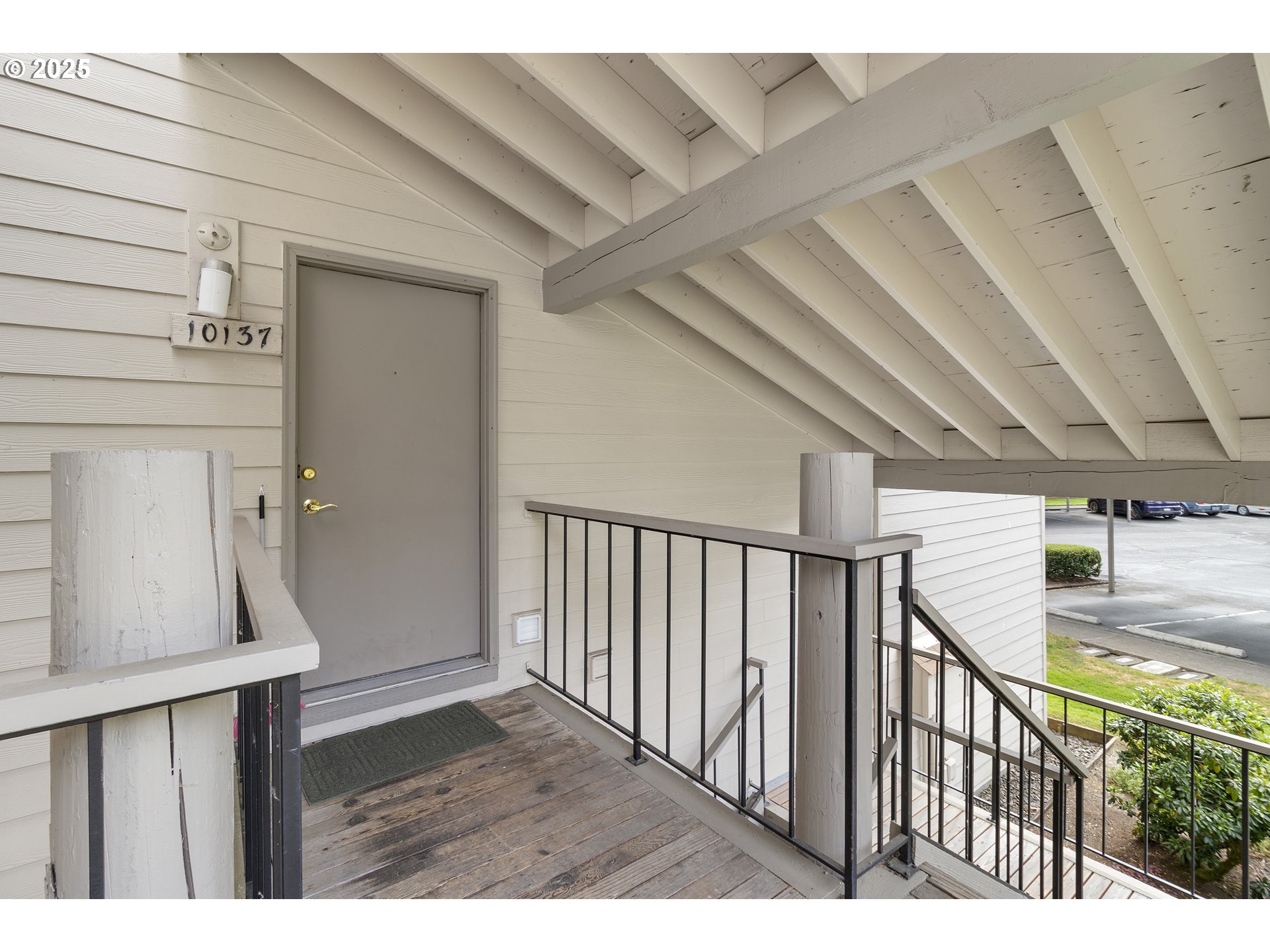 10137 Southwest Trapper Terrace Beaverton, OR 97008 - Photo 6 of 39 a view of a hallway with wooden floor and staircase
