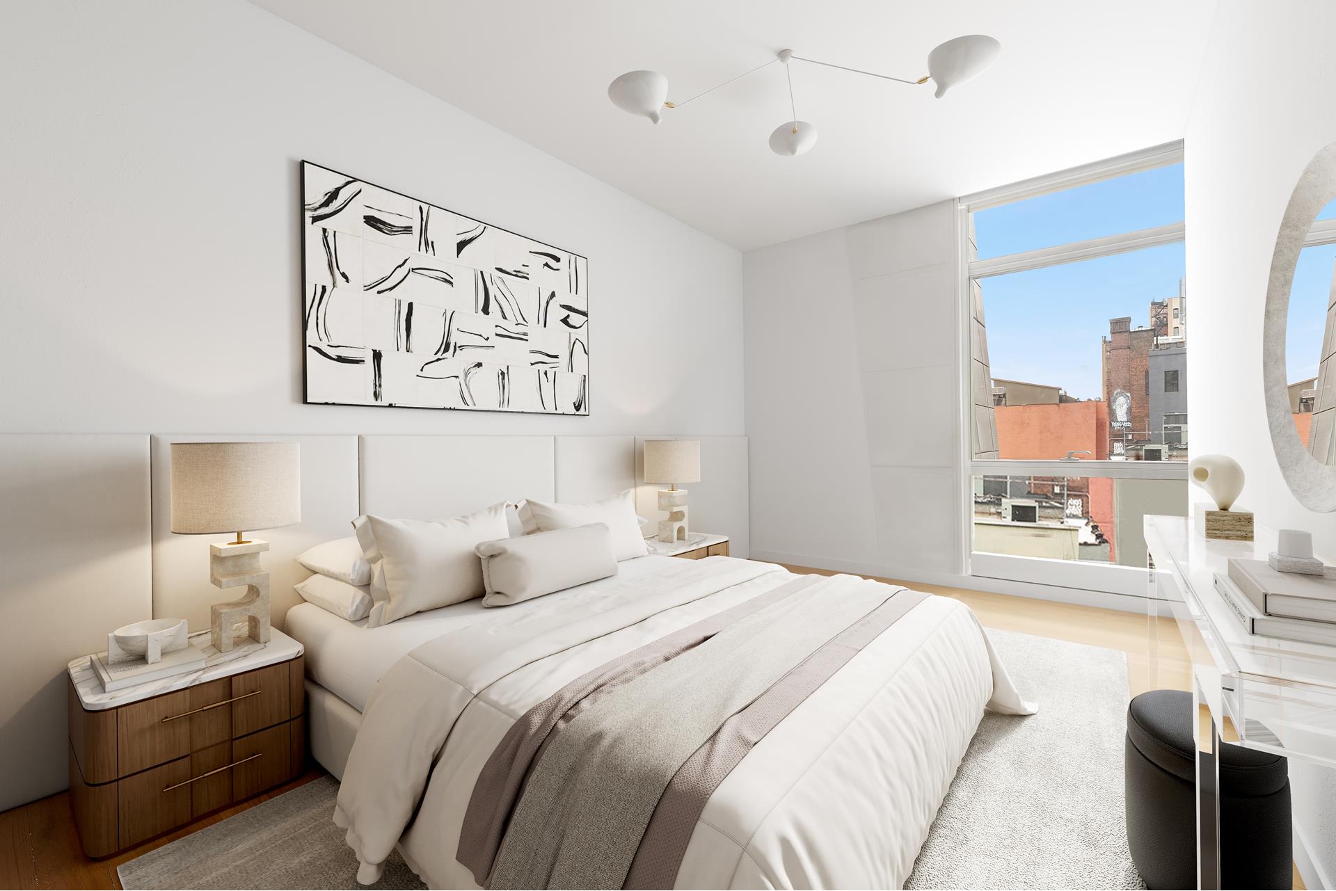 245 10th Avenue, Unit 5W Manhattan, NY 10001 - Photo 7 of 11 a bedroom with a bed and a painting on the wall