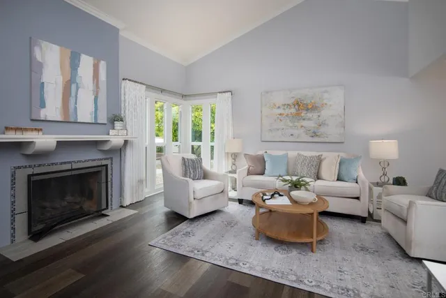 a living room with furniture and a fireplace