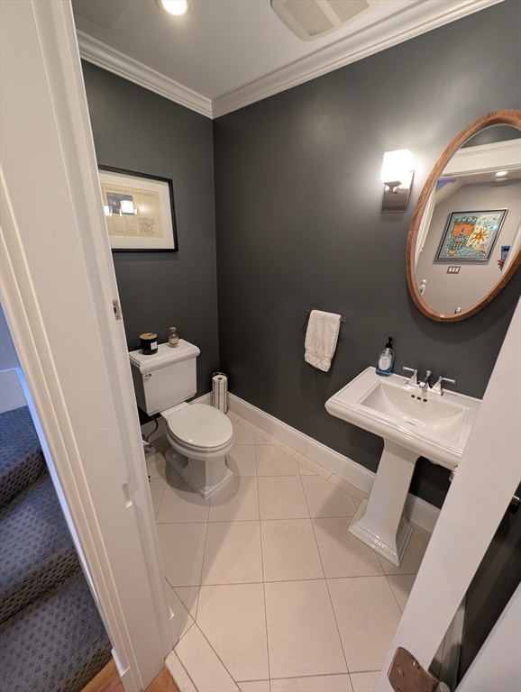 86 West Springfield Street, Unit 3 Boston, MA 02118 - Photo 11 of 39 a bathroom with a toilet sink and mirror