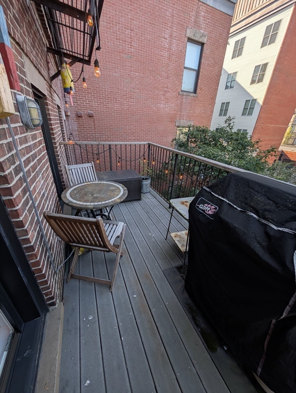 86 West Springfield Street, Unit 3 Boston, MA 02118 - Photo 17 of 39 a view of balcony with wooden floor and outdoor seating