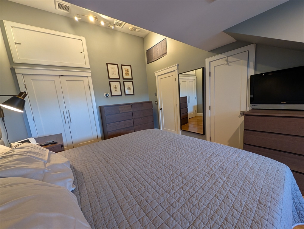 86 West Springfield Street, Unit 3 Boston, MA 02118 - Photo 24 of 39 a bedroom with a bed and a flat screen tv