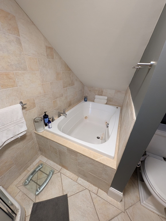 86 West Springfield Street, Unit 3 Boston, MA 02118 - Photo 26 of 39 a white bath tub sitting in a bathroom