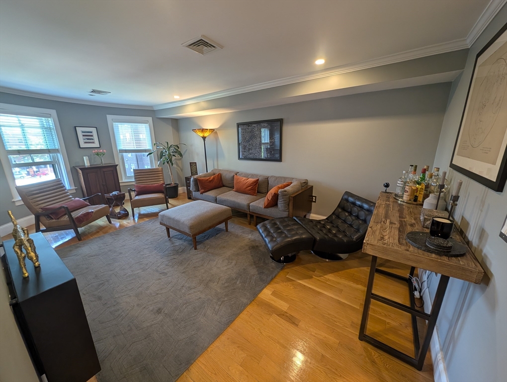 86 West Springfield Street, Unit 3 Boston, MA 02118 - Photo 3 of 39 a living room with furniture and a flat screen tv