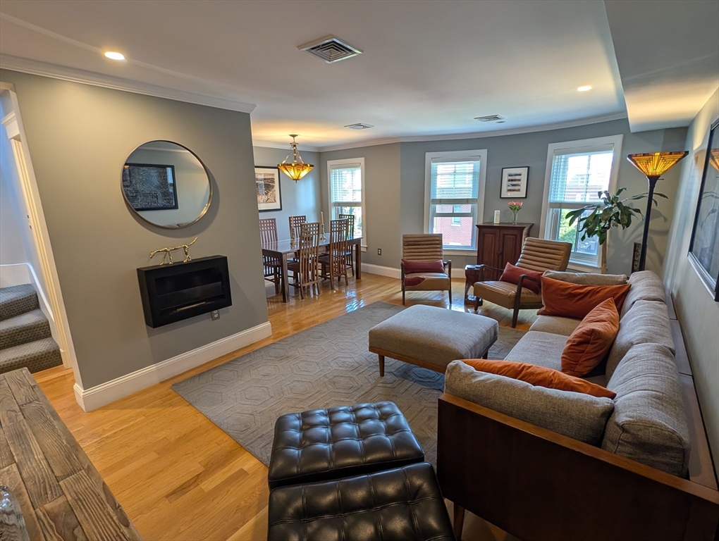 86 West Springfield Street, Unit 3 Boston, MA 02118 - Photo 4 of 39 a living room with furniture and a fireplace