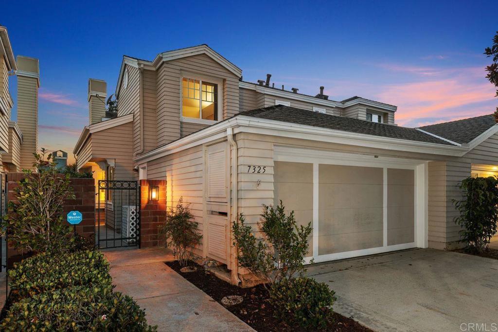 7325 Lantana Terrace Carlsbad, CA 92011 - Photo 1 of 36 a view of a house with a small yard and potted plants