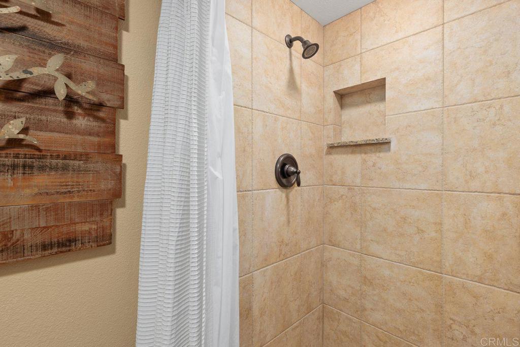 7325 Lantana Terrace Carlsbad, CA 92011 - Photo 15 of 36 a bathroom with a shower