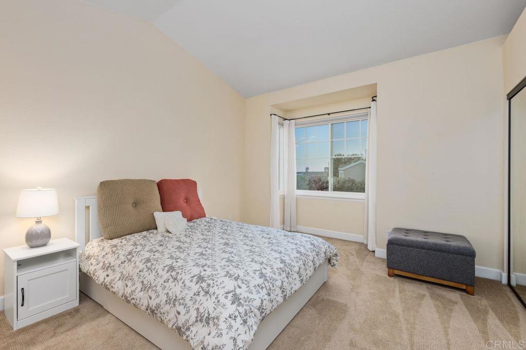 7325 Lantana Terrace Carlsbad, CA 92011 - Photo 17 of 36 a bedroom with a bed and window