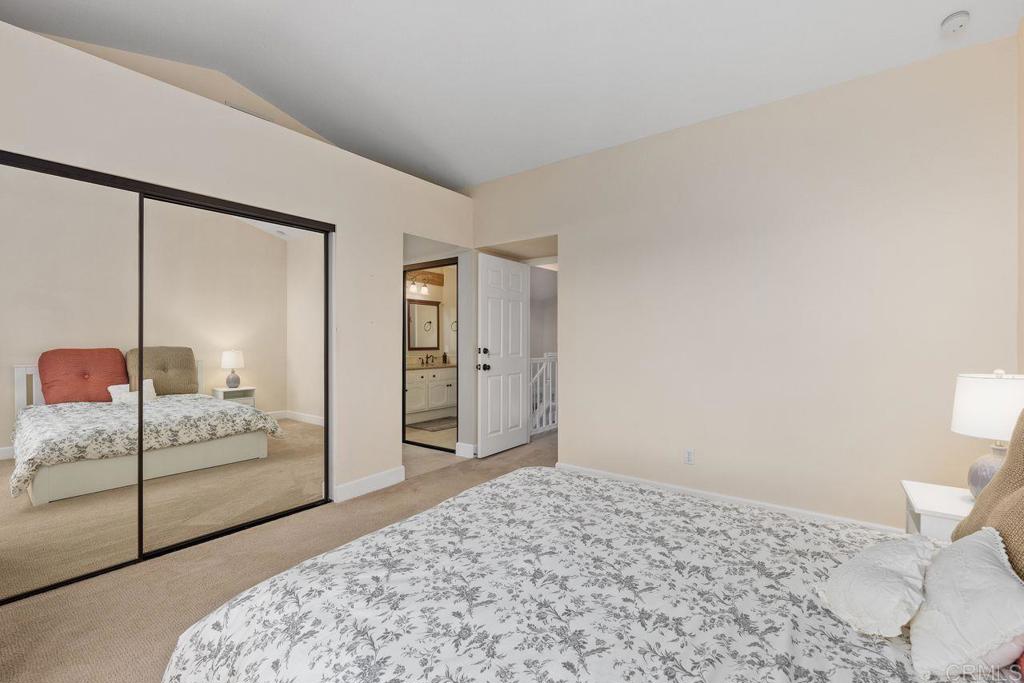 7325 Lantana Terrace Carlsbad, CA 92011 - Photo 18 of 36 a bedroom with a bed and a dresser