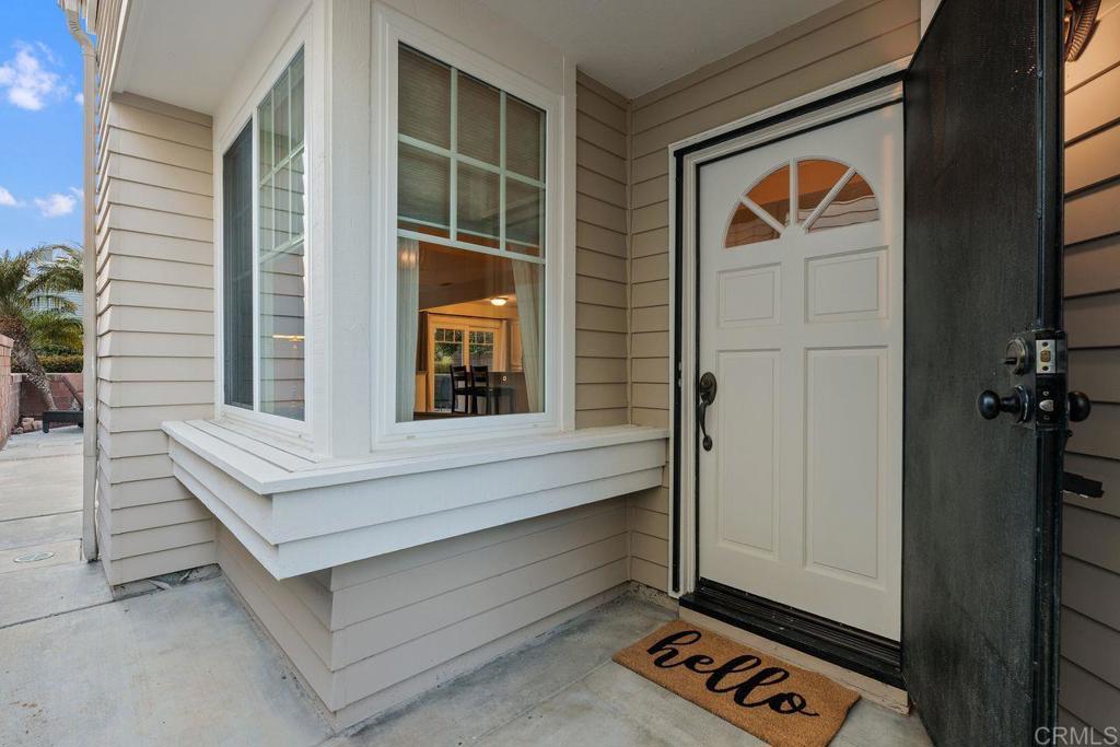 7325 Lantana Terrace Carlsbad, CA 92011 - Photo 4 of 36 a front view of a house with entryway
