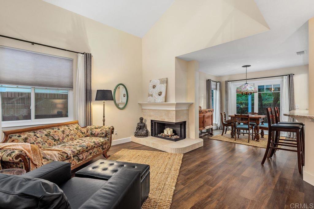 7325 Lantana Terrace Carlsbad, CA 92011 - Photo 7 of 36 a living room with furniture and a fireplace