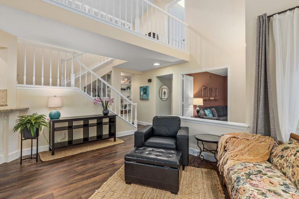 7325 Lantana Terrace Carlsbad, CA 92011 - Photo 8 of 36 a living room with furniture and wooden floor