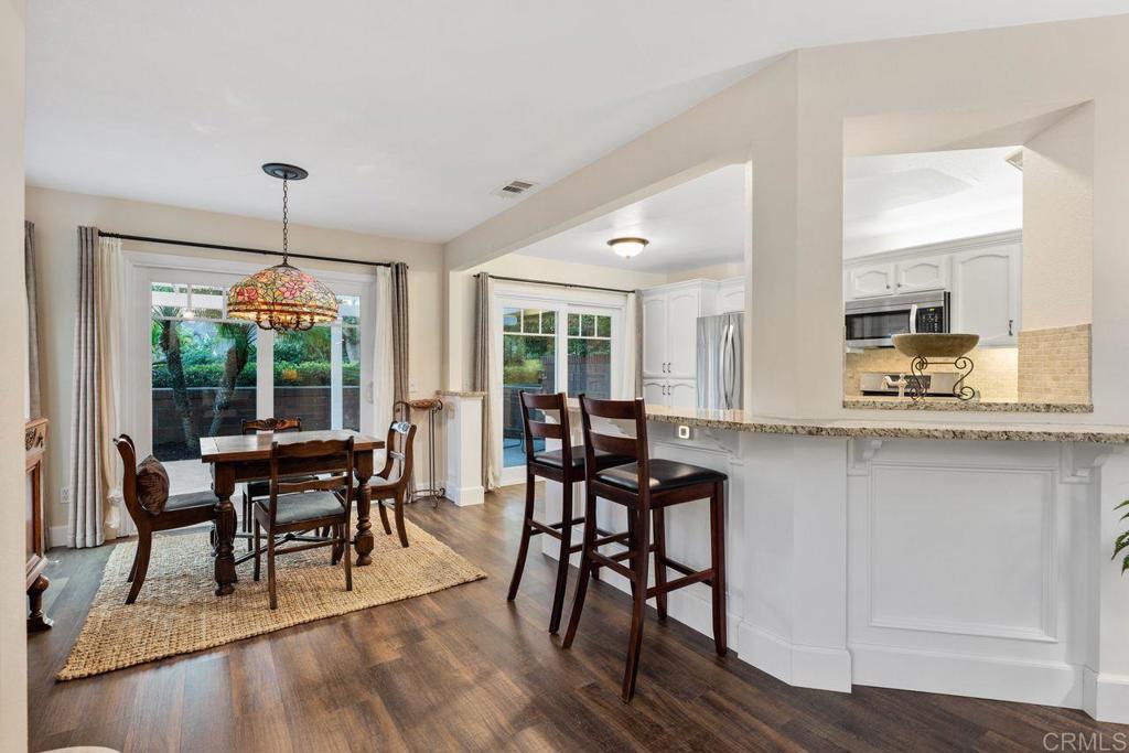 7325 Lantana Terrace Carlsbad, CA 92011 - Photo 9 of 36 a dining room with furniture window wooden floor