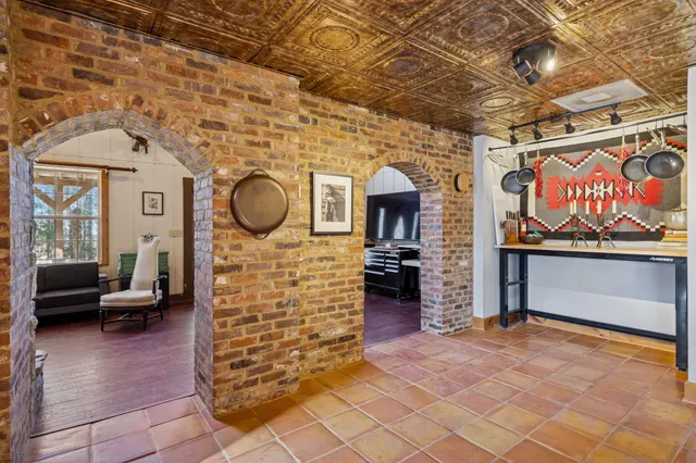 a room with wooden floor and window