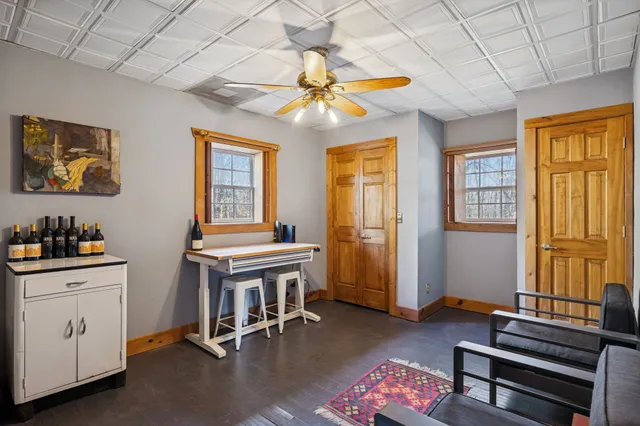 a view of a livingroom with furniture and a fireplace