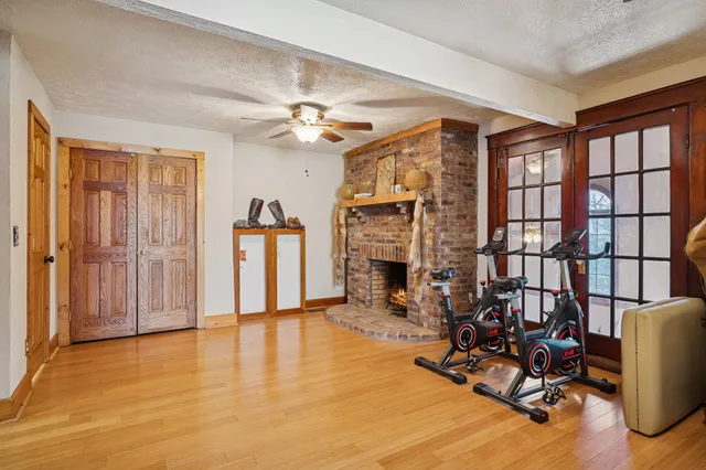 a view of a yard with wooden fence
