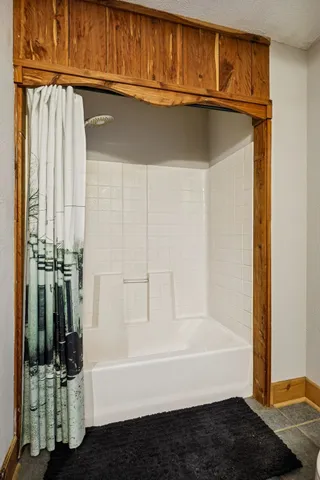 a view of a livingroom with furniture and a flat screen tv