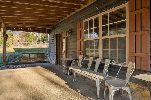 a living room with fireplace furniture and wooden floor