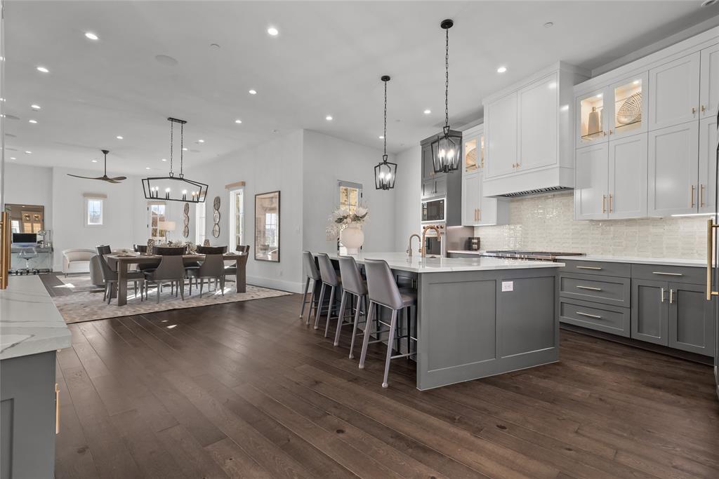 1 Piedra Court Roanoke, TX 76262 - Photo 12 of 40 a kitchen with a table chairs refrigerator and cabinets