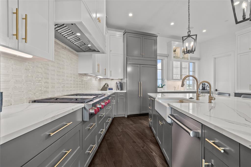 1 Piedra Court Roanoke, TX 76262 - Photo 14 of 40 a kitchen with stainless steel appliances granite countertop a sink a stove and a refrigerator