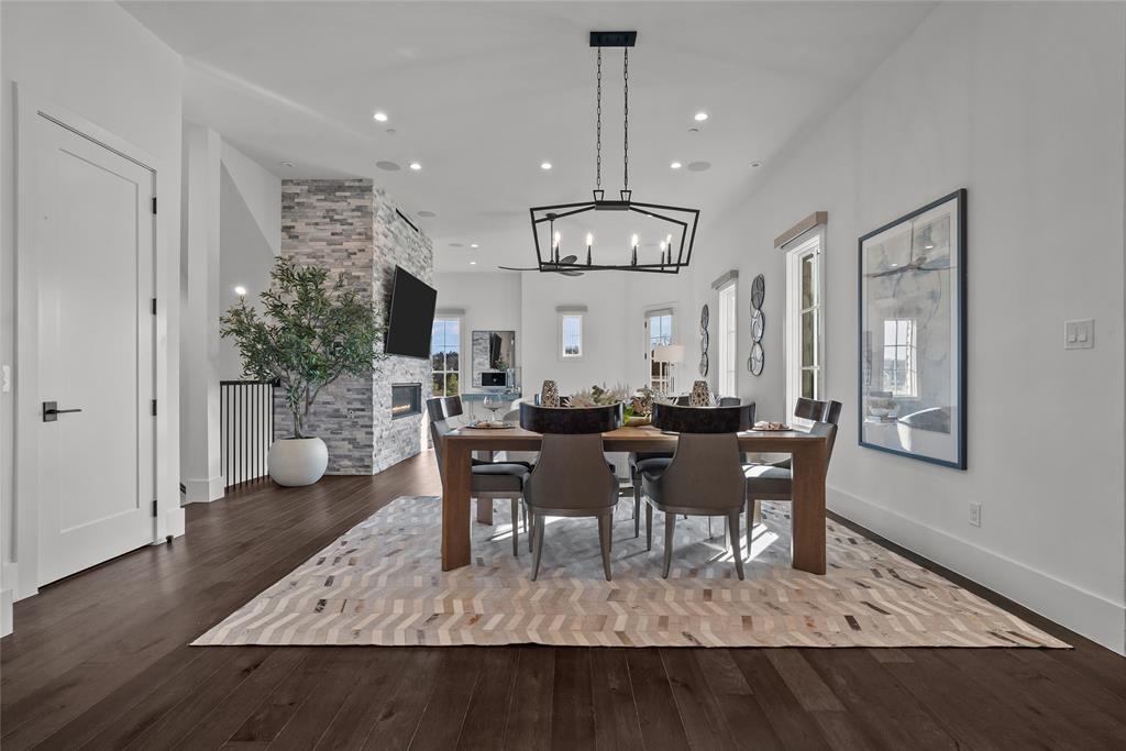 1 Piedra Court Roanoke, TX 76262 - Photo 16 of 40 a view of a dining room with furniture window and wooden floor