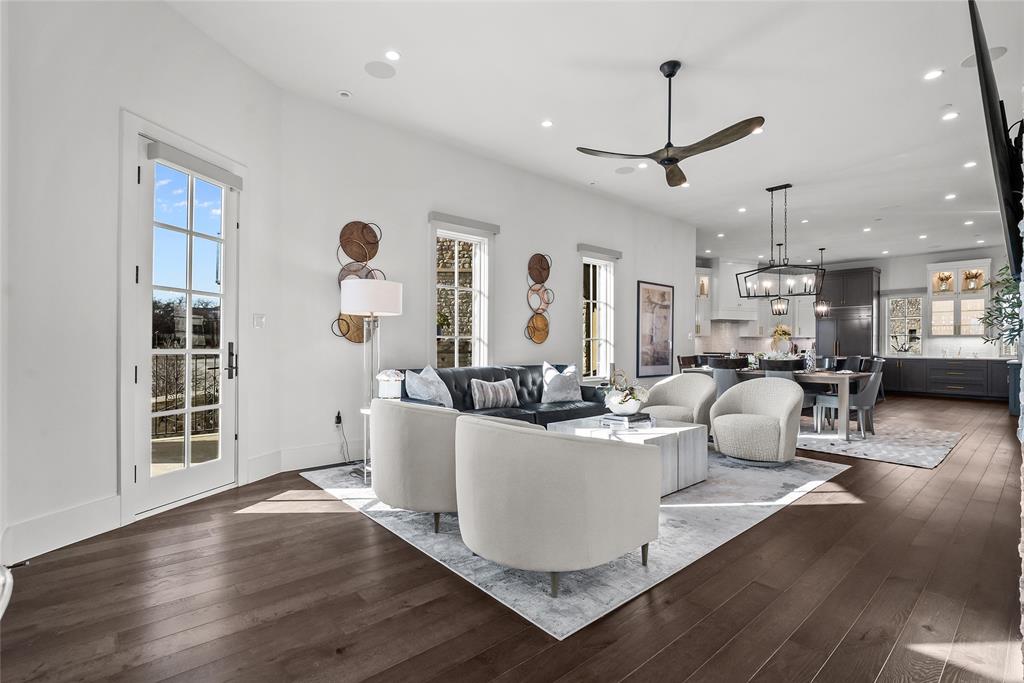 1 Piedra Court Roanoke, TX 76262 - Photo 19 of 40 a living room with couches a coffee table and kitchen view with wooden floor