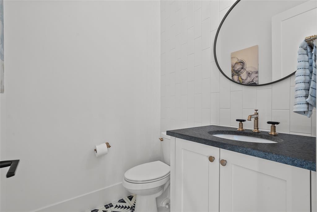 1 Piedra Court Roanoke, TX 76262 - Photo 21 of 40 a bathroom with a sink and a mirror