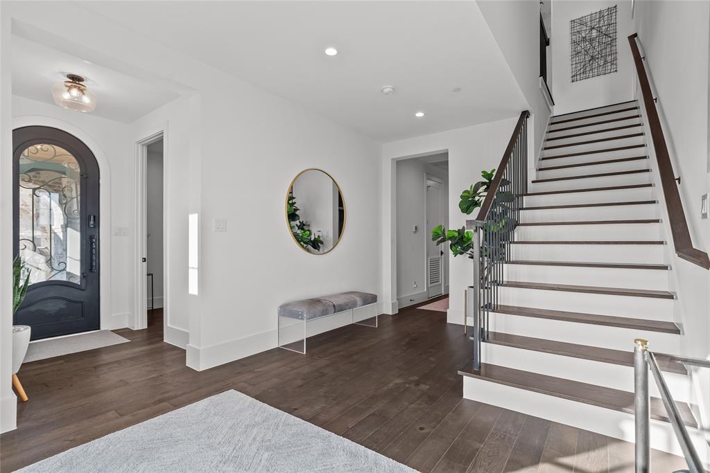 1 Piedra Court Roanoke, TX 76262 - Photo 5 of 40 a view of a hallway with entryway wooden floor and front door