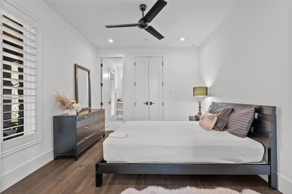 1 Piedra Court Roanoke, TX 76262 - Photo 7 of 40 a bedroom with a bed a dresser and potted plants