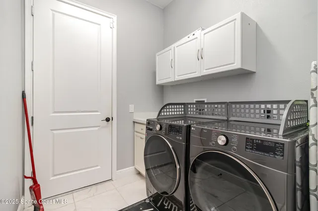 a bathroom with a sink a toilet and shower curtain