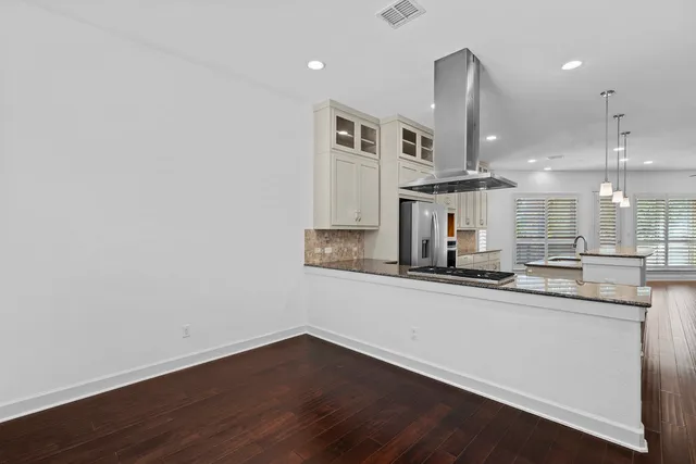 a kitchen with stainless steel appliances a sink and a stove