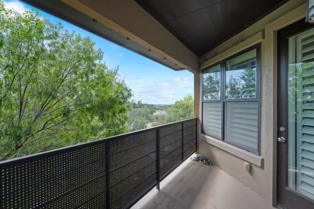 a porch with a table in balcony