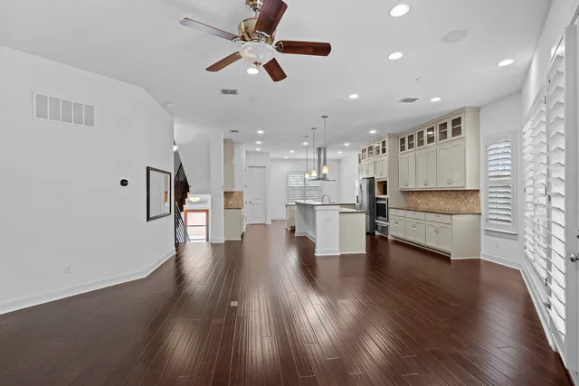 a view of kitchen with cabinets and wooden floor