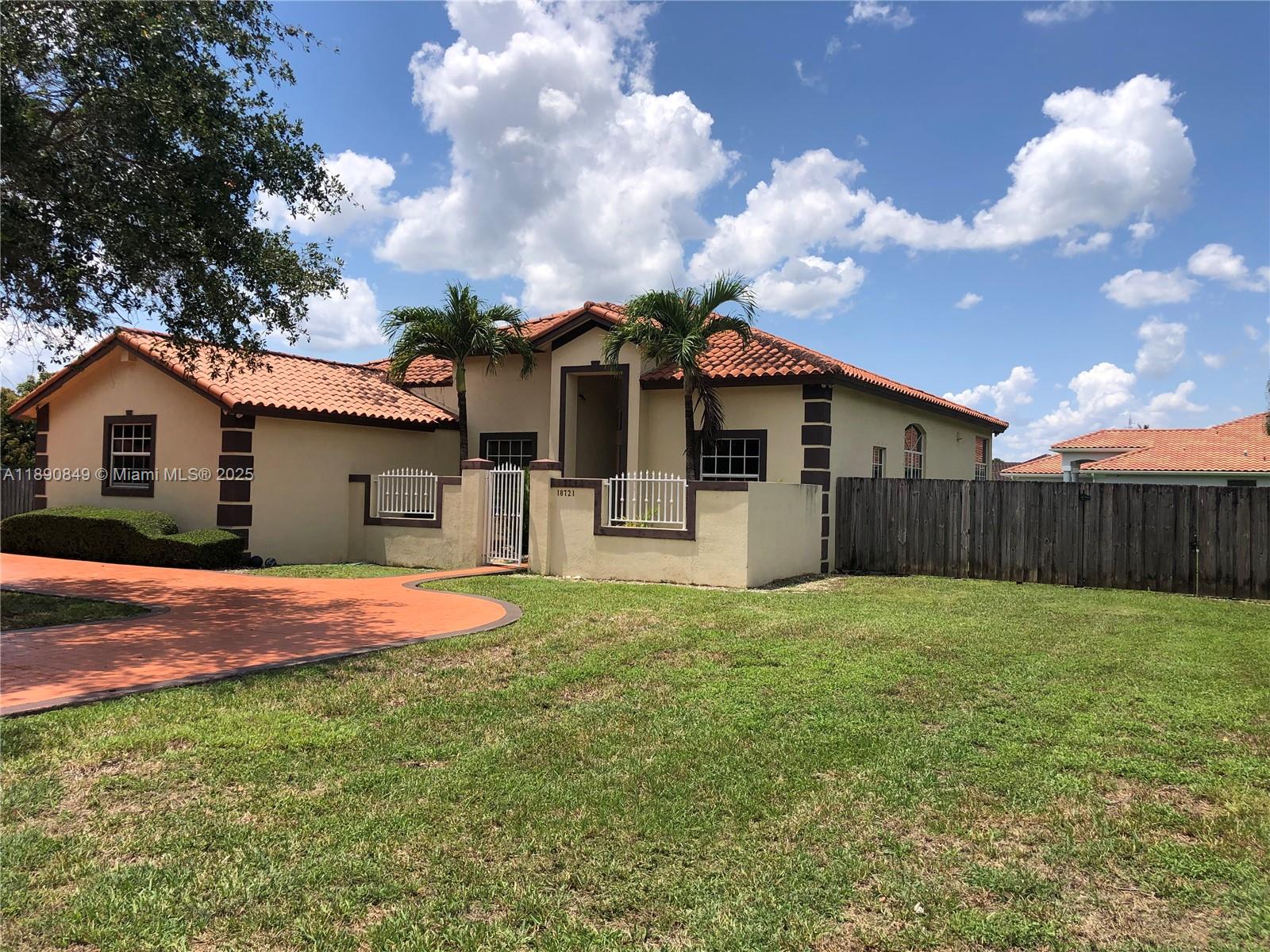 18721 Southwest 291st Terrace Homestead, FL 33030 - Photo 2 of 15 a front view of house with yard and trees