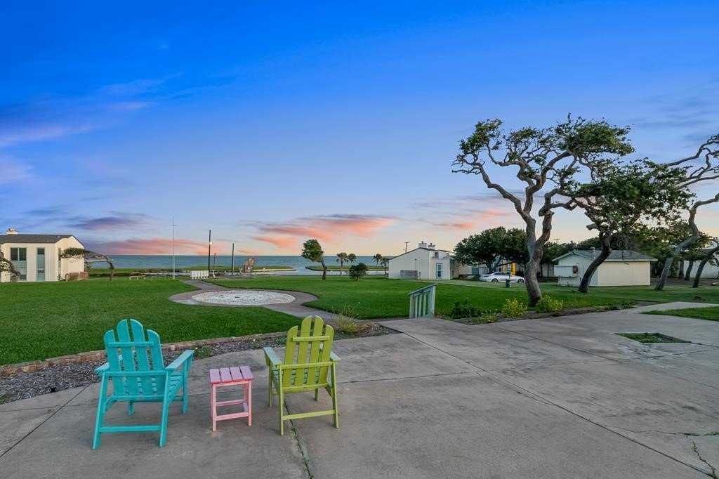 2003 North Fulton Beach Road, Unit 34 34 Rockport, TX 78382 - Photo 24 of 38 a view of a table and chairs in the garden