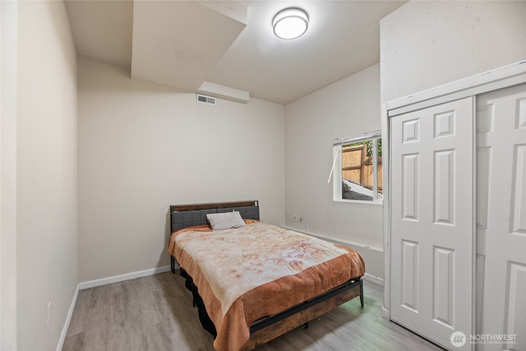 10606 68th Place South Seattle, WA 98178 - Photo 23 of 31 a bedroom with a bed and a window